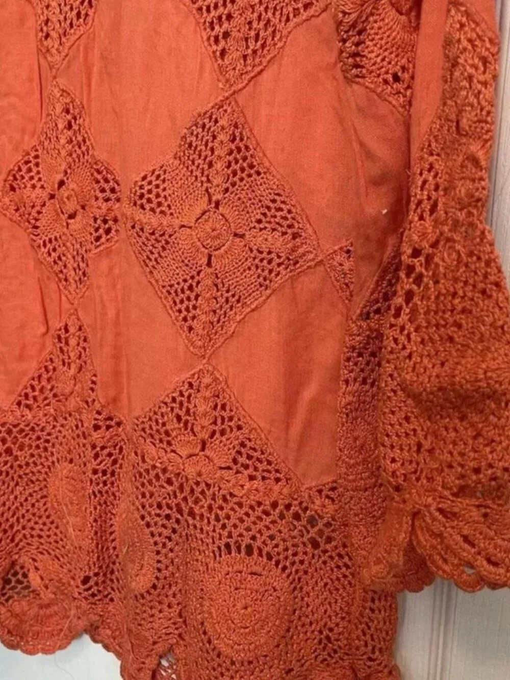 Free People orange crochet top with bell sleeves size XS